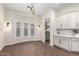 Breakfast nook featuring white shaker cabinets, subway tile backsplash, and pendant lights at 4376 S Santiago Way, Chandler, AZ 85248