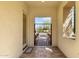 Inviting courtyard entryway with decorative wrought iron gate and serene garden view at 4376 S Santiago Way, Chandler, AZ 85248