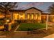 Twilight exterior view of charming single-Gathering home with a manicured front lawn at 4376 S Santiago Way, Chandler, AZ 85248