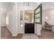 Elegant foyer with stylish split door, hardwood floors, and neutral tones at 4376 S Santiago Way, Chandler, AZ 85248