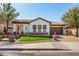 Beautiful single-story home with manicured lawn, stone accents, and a tile roof at 4376 S Santiago Way, Chandler, AZ 85248