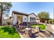 Inviting single-story home with lush lawn, stone pillar accents, and a tiled roof at 4376 S Santiago Way, Chandler, AZ 85248