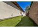 A backyard putting green, perfect for practicing your short game, along the side of the home at 4376 S Santiago Way, Chandler, AZ 85248