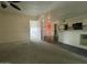 View of open living area with views of kitchen, tile floors and access to bedrooms at 4416 E Capistrano Ave, Phoenix, AZ 85044