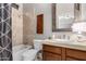 A full bathroom includes a sink with a vanity, toilet, shower/tub, and a mirror with a wood frame at 4438 E Millbrae Ln, Gilbert, AZ 85234