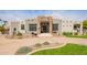 Stunning single-story home featuring desert landscaping and a circular driveway at 4438 E Millbrae Ln, Gilbert, AZ 85234