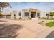 Well-maintained single-story home featuring desert landscaping and circular driveway at 4438 E Millbrae Ln, Gilbert, AZ 85234