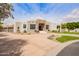 Landscaped single-story home featuring desert landscaping and a circular driveway at 4438 E Millbrae Ln, Gilbert, AZ 85234