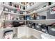 Organized walk-in pantry with shelves for storage, maximizing space and keeping items tidy, offering convenience at 4438 E Millbrae Ln, Gilbert, AZ 85234