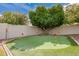 Private putting green in a landscaped backyard, ideal for golf enthusiasts to practice their short game at 4438 E Millbrae Ln, Gilbert, AZ 85234