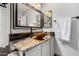 Modern bathroom with granite countertop, copper basin sink, framed mirror, and updated finishes at 4444 W Chama Dr, Glendale, AZ 85310