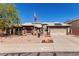 Charming single-story home featuring a tiled roof, desert landscaping, and a two-car garage at 4444 W Chama Dr, Glendale, AZ 85310