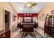 Warm bedroom with a ceiling fan, large windows and beautiful antique furnishings at 4444 W Chama Dr, Glendale, AZ 85310