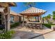 Outdoor kitchen and bar area, offering a stylish and functional space for cooking and entertaining at 4444 W Chama Dr, Glendale, AZ 85310