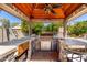 Covered outdoor kitchen with stainless steel appliances, perfect for grilling and dining in a shaded space at 4444 W Chama Dr, Glendale, AZ 85310