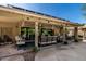 Covered patio featuring comfortable seating, ceiling fans, and view of the pool at 4444 W Chama Dr, Glendale, AZ 85310