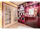 Custom wine cellar featuring glass-door storage, built-in shelving, and a display area at 4444 W Chama Dr, Glendale, AZ 85310