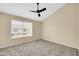 Bedroom featuring neutral walls, carpet flooring, and a window allowing natural light into the living space at 4601 N 102Nd Ave # 1036, Phoenix, AZ 85037