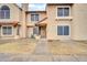 Charming two-story townhome with desert landscaping and a welcoming entrance at 4601 N 102Nd Ave # 1036, Phoenix, AZ 85037