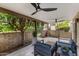 Inviting covered patio with comfortable seating and ceiling fans, perfect for outdoor relaxation and enjoying the well-manicured landscaping at 4800 N 68Th St # 109, Scottsdale, AZ 85251