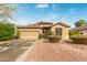 Charming single-story home with a two-car garage and low maintenance desert landscaping in the front yard at 4806 E Thunderbird Dr, Chandler, AZ 85249