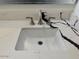 Close up on a clean bathroom sink and black veined countertop at 4807 E Everett Dr, Scottsdale, AZ 85254