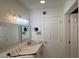 Bathroom with elegant mirrors, modern lighting, and black veined countertop at 4807 E Everett Dr, Scottsdale, AZ 85254