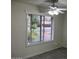 This bedroom features tile floors, a ceiling fan, and a large window for natural light at 4807 E Everett Dr, Scottsdale, AZ 85254