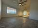 Bright open-plan living room featuring tile flooring and a modern ceiling fan at 4807 E Everett Dr, Scottsdale, AZ 85254