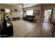 Bright living room featuring tile flooring and backyard patio access at 4939 W Harwell Rd, Laveen, AZ 85339