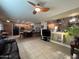 Comfortable living room featuring tile floors, a ceiling fan, and ample space for furniture at 4939 W Harwell Rd, Laveen, AZ 85339