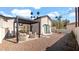 Inviting backyard featuring a pergola, comfortable seating, and a well-maintained landscape at 6114 E Calle Del Norte --, Scottsdale, AZ 85251