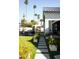 Lush backyard with a stepping stone path and outdoor dining and lounge areas at 6114 E Calle Del Norte --, Scottsdale, AZ 85251