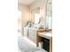 Modern bathroom vanity with double mirrors, soft lighting and stone countertops at 6114 E Calle Del Norte --, Scottsdale, AZ 85251