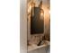 Modern powder room featuring marble countertop, unique gold light fixtures, and modern fixtures at 6114 E Calle Del Norte --, Scottsdale, AZ 85251