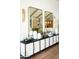 Stylish entryway with console table, decorative mirrors, and modern gold sconces at 6114 E Calle Del Norte --, Scottsdale, AZ 85251