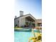 Beautiful modern home exterior featuring a pool, lounge seating, and high ceilings at 6114 E Calle Del Norte --, Scottsdale, AZ 85251