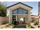 Modern home with striking architectural details, landscaped front yard, and welcoming curb appeal at 6114 E Calle Del Norte --, Scottsdale, AZ 85251