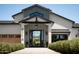 Beautiful home entrance featuring a striking front door and manicured bushes at 6114 E Calle Del Norte --, Scottsdale, AZ 85251