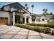 Beautiful home with a manicured lawn, landscaped garden, and striking curb appeal at 6114 E Calle Del Norte --, Scottsdale, AZ 85251