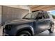 Garage with Land Rover Defender parked in front of gray garage cabinets at 6114 E Calle Del Norte --, Scottsdale, AZ 85251