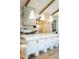 Bright kitchen features a large island with white marble countertops and stylish bar stool seating at 6114 E Calle Del Norte --, Scottsdale, AZ 85251