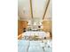 Open concept kitchen with island seating, wooden beams, and bright, modern lighting at 6114 E Calle Del Norte --, Scottsdale, AZ 85251