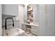 Well-organized laundry room with custom cabinetry, marble countertops, and sink at 6114 E Calle Del Norte --, Scottsdale, AZ 85251