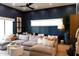 Living room showcases stylish, dark blue walls, neutral furniture, and hardwood floors at 6114 E Calle Del Norte --, Scottsdale, AZ 85251