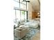 Large living area featuring sectional sofa, high ceilings, and floor-to-ceiling windows at 6114 E Calle Del Norte --, Scottsdale, AZ 85251