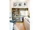 Cozy living room features built-in shelving, comfortable seating, and neutral decor at 6114 E Calle Del Norte --, Scottsdale, AZ 85251