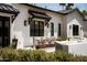 Outdoor dining featuring a stone patio, lush plants, and shaded seating at 6114 E Calle Del Norte --, Scottsdale, AZ 85251