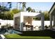 Outdoor kitchen perfect for entertaining, with a dining area and ample counter space, overlooking the pool at 6114 E Calle Del Norte --, Scottsdale, AZ 85251