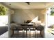 Outdoor kitchen featuring a grill, counter seating, and modern lighting fixtures at 6114 E Calle Del Norte --, Scottsdale, AZ 85251